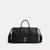 Bolsa Compass 35 de Disney x Coach con Mickey Mouse