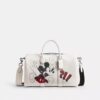 Bolsa Compass 35 de Disney x Coach con Mickey Mouse