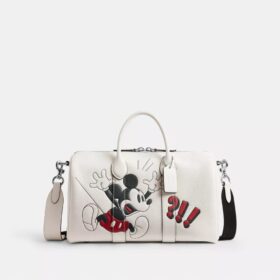 Bolsa Compass 35 de Disney x Coach con Mickey Mouse