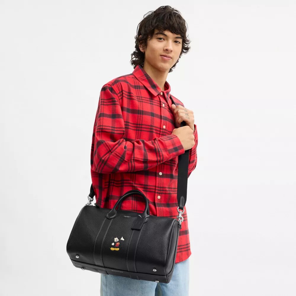 Bolsa Compass 35 de Disney x Coach con Mickey Mouse