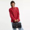 Bolsa Compass 35 de Disney x Coach con Mickey Mouse