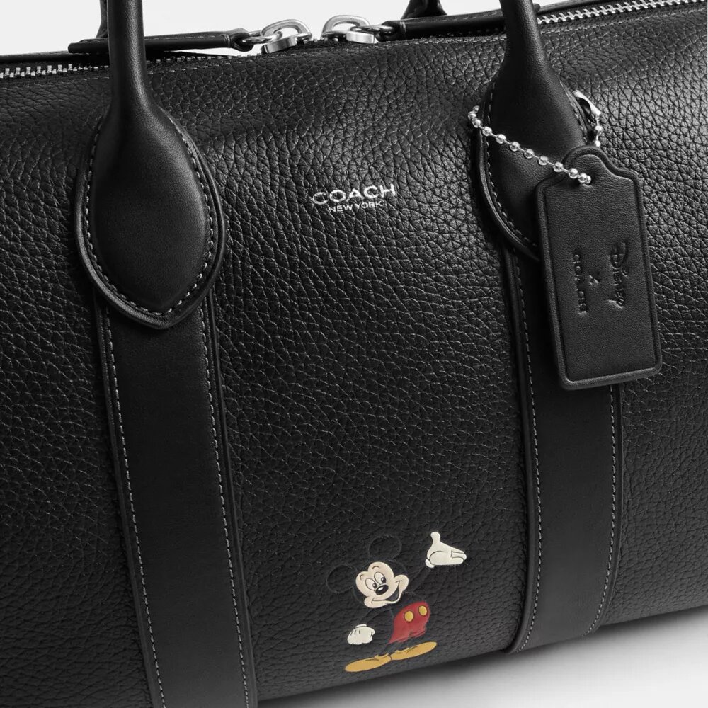 Bolsa Compass 35 de Disney x Coach con Mickey Mouse