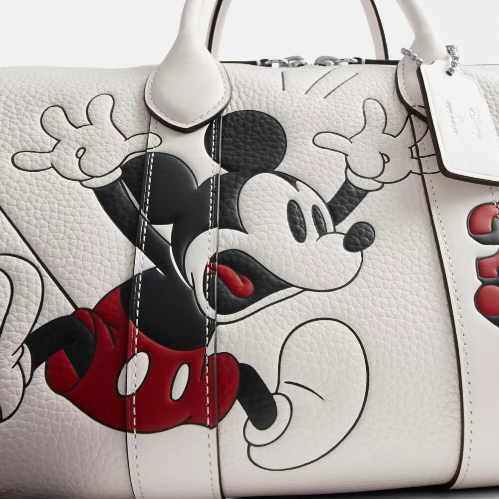 Bolsa Compass 35 de Disney x Coach con Mickey Mouse