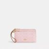 Bolsa de pulsera con doble cremallera en Signature Canvas con Charms