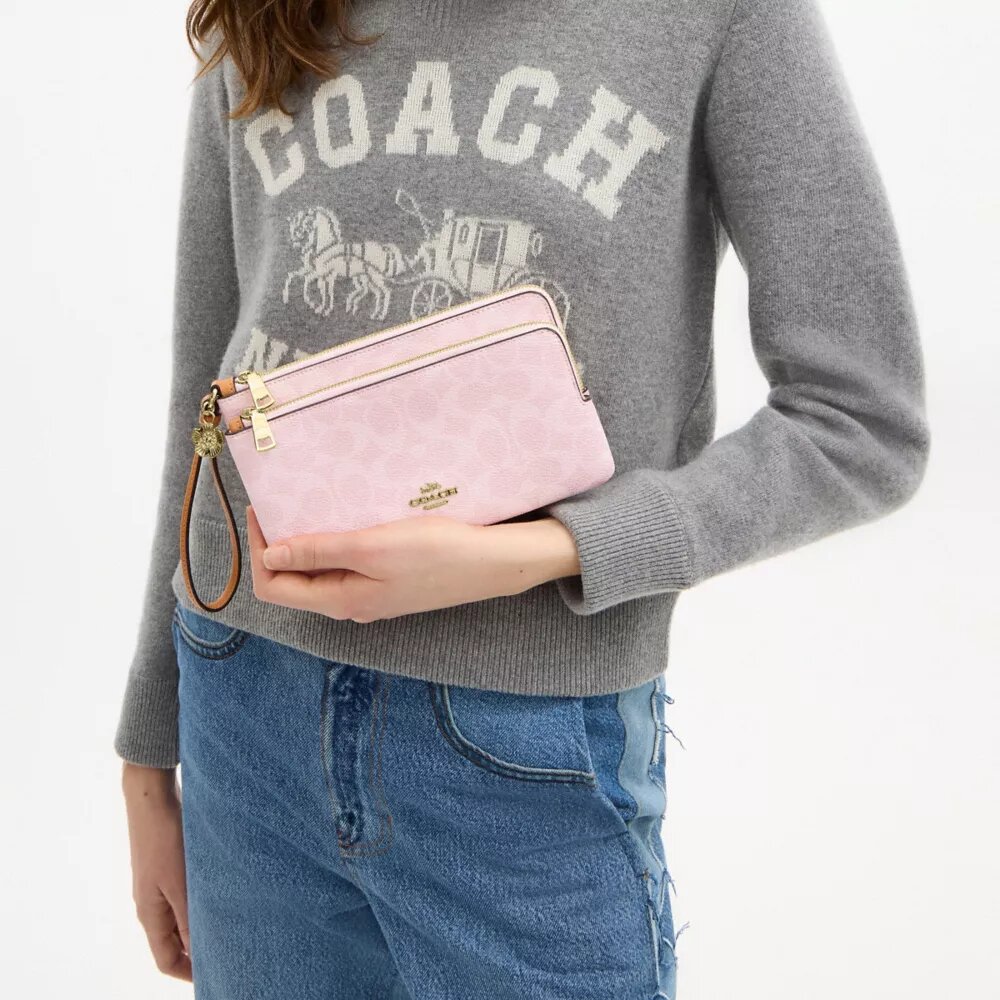 Bolsa de pulsera con doble cremallera en Signature Canvas con Charms