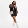 Bolso bandolera Carey en Signature Canvas