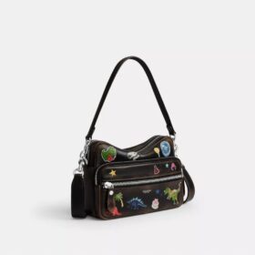 Bolso bandolera Dakota de Rexy para su décimo cumpleaños, en cuero desgastado con estampado de calcomanías