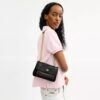 Bolso bandolera Elodie 18 en Signature Canvas