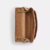 Bolso bandolera Elodie en denim desgastado con acolchado