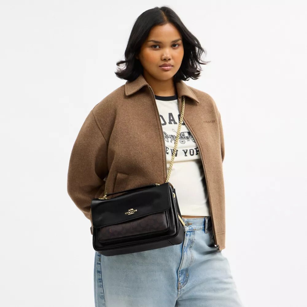 Bolso bandolera Elodie en Signature Canvas