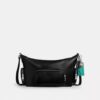 Bolso bandolera Finn con bolsillos y dijes