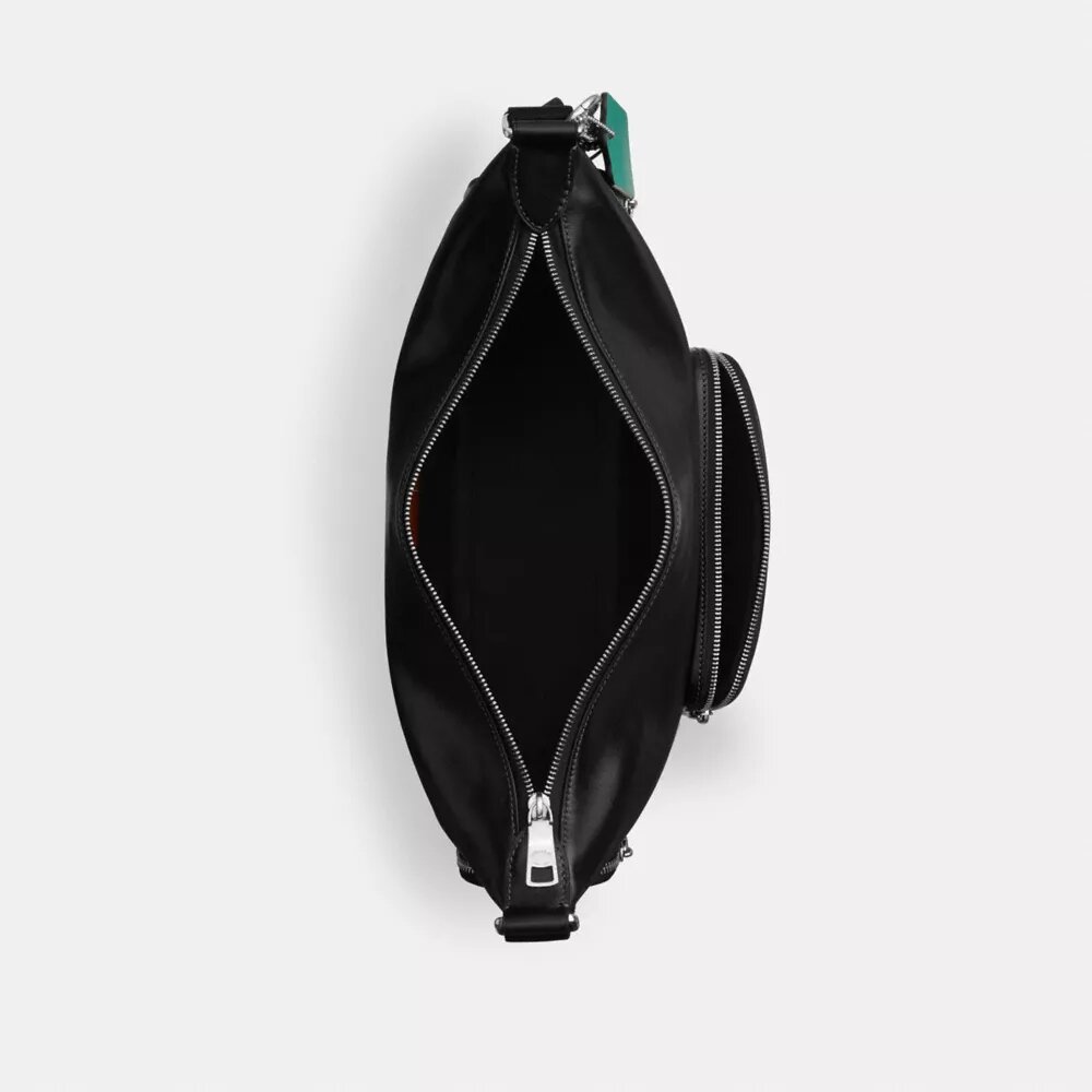 Bolso bandolera Finn con bolsillos y dijes