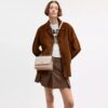 Bolso bandolera Klare en Signature Canvas