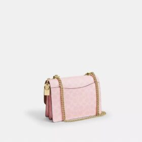 Bolso bandolera Klare en Signature Canvas con Charms