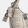 Bolso bandolera mini Carmen con estampado de periódico