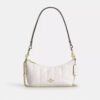 Bolso de hombro Caitlin con acolchado y dije