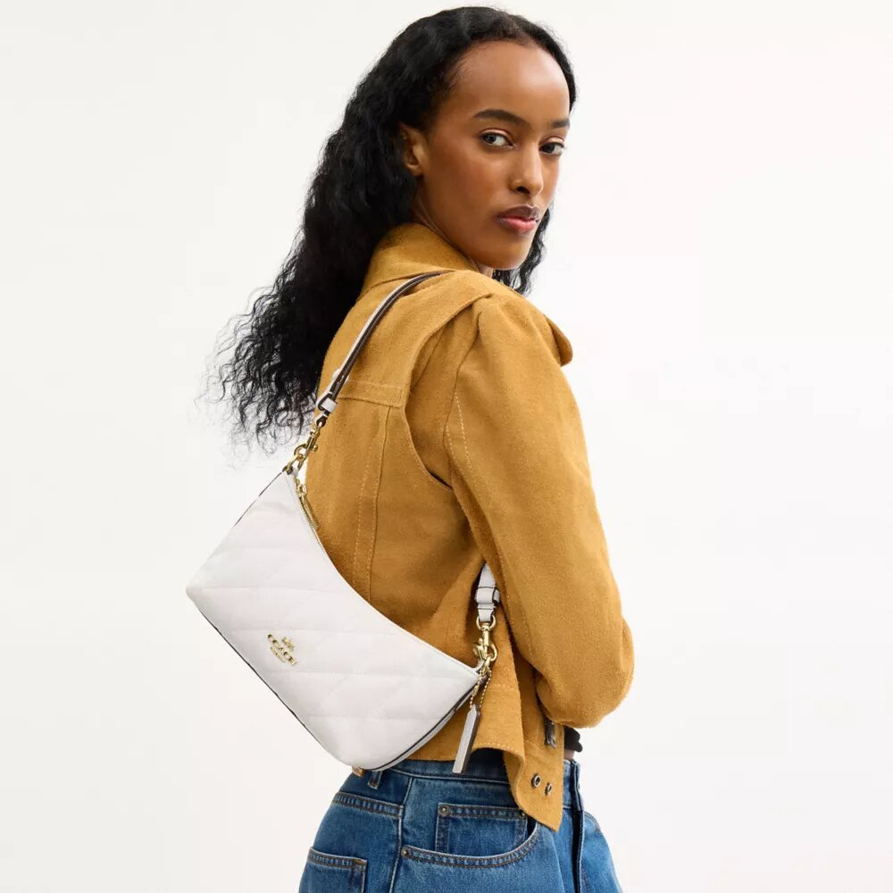 Bolso de hombro Caitlin con acolchado y dije