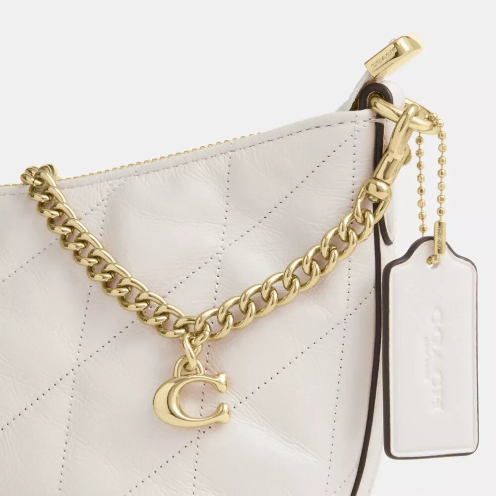 Bolso de hombro Caitlin con acolchado y dije