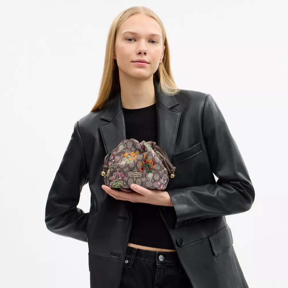 Bolso Faye Mini con cordón en jacquard exclusivo con bordado floral