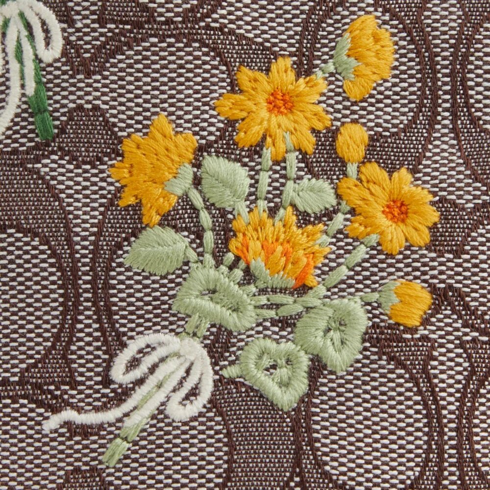 Bolso Faye Mini con cordón en jacquard exclusivo con bordado floral