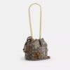 Bolso Faye Mini con cordón en jacquard exclusivo con bordado floral