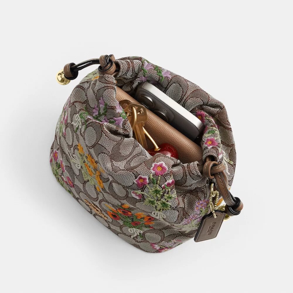 Bolso Faye Mini con cordón en jacquard exclusivo con bordado floral