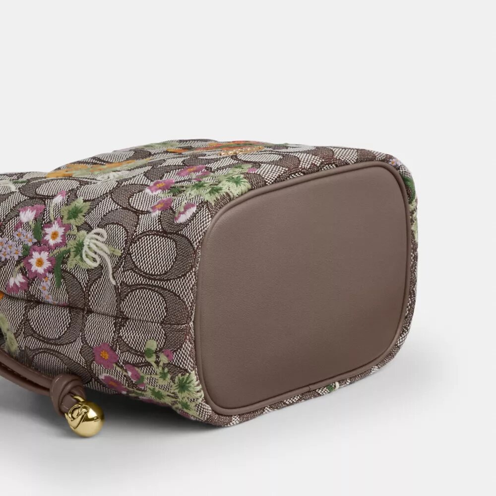 Bolso Faye Mini con cordón en jacquard exclusivo con bordado floral
