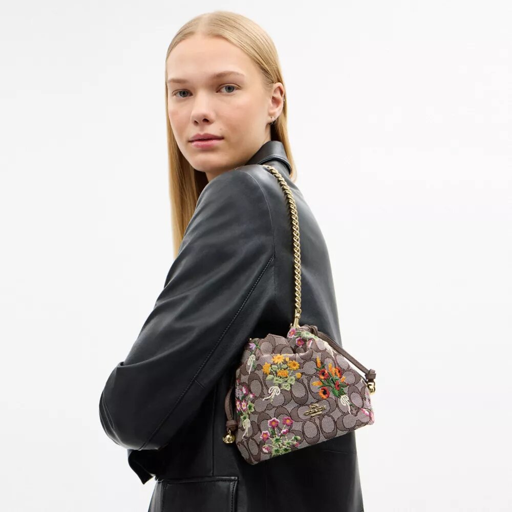Bolso Faye Mini con cordón en jacquard exclusivo con bordado floral