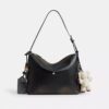 Bolso mensajero Mott de 38 en cuero desgastado con Charms