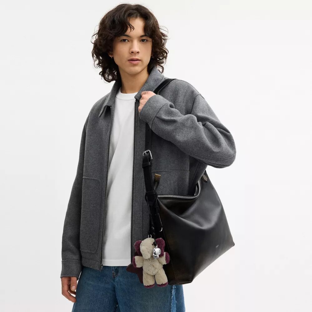 Bolso mensajero Mott de 38 en cuero desgastado con Charms