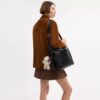 Bolso mensajero Mott de 38 en cuero desgastado con Charms