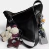 Bolso mensajero Mott de 38 en cuero desgastado con Charms
