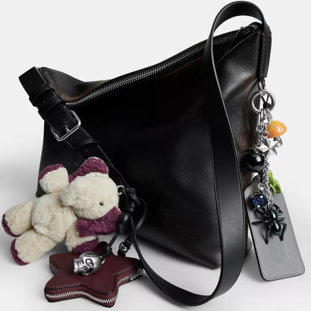 Bolso mensajero Mott de 38 en cuero desgastado con Charms