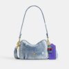 Bolso mini Carey de bandolera en denim desgastado con Charms