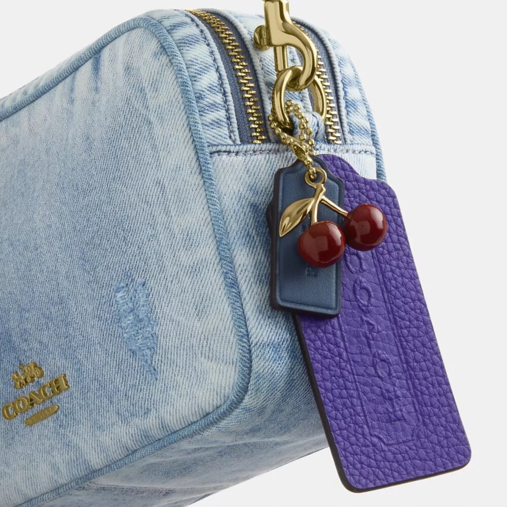 Bolso mini Carey de bandolera en denim desgastado con Charms