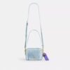 Bolso mini Carey de bandolera en denim desgastado con Charms