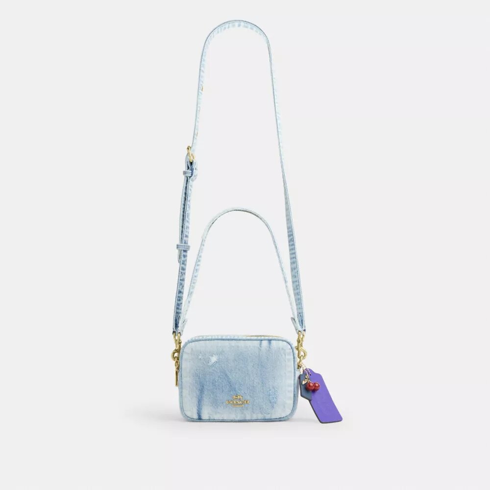 Bolso mini Carey de bandolera en denim desgastado con Charms