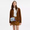 Bolso mini Carey de bandolera en denim desgastado con Charms