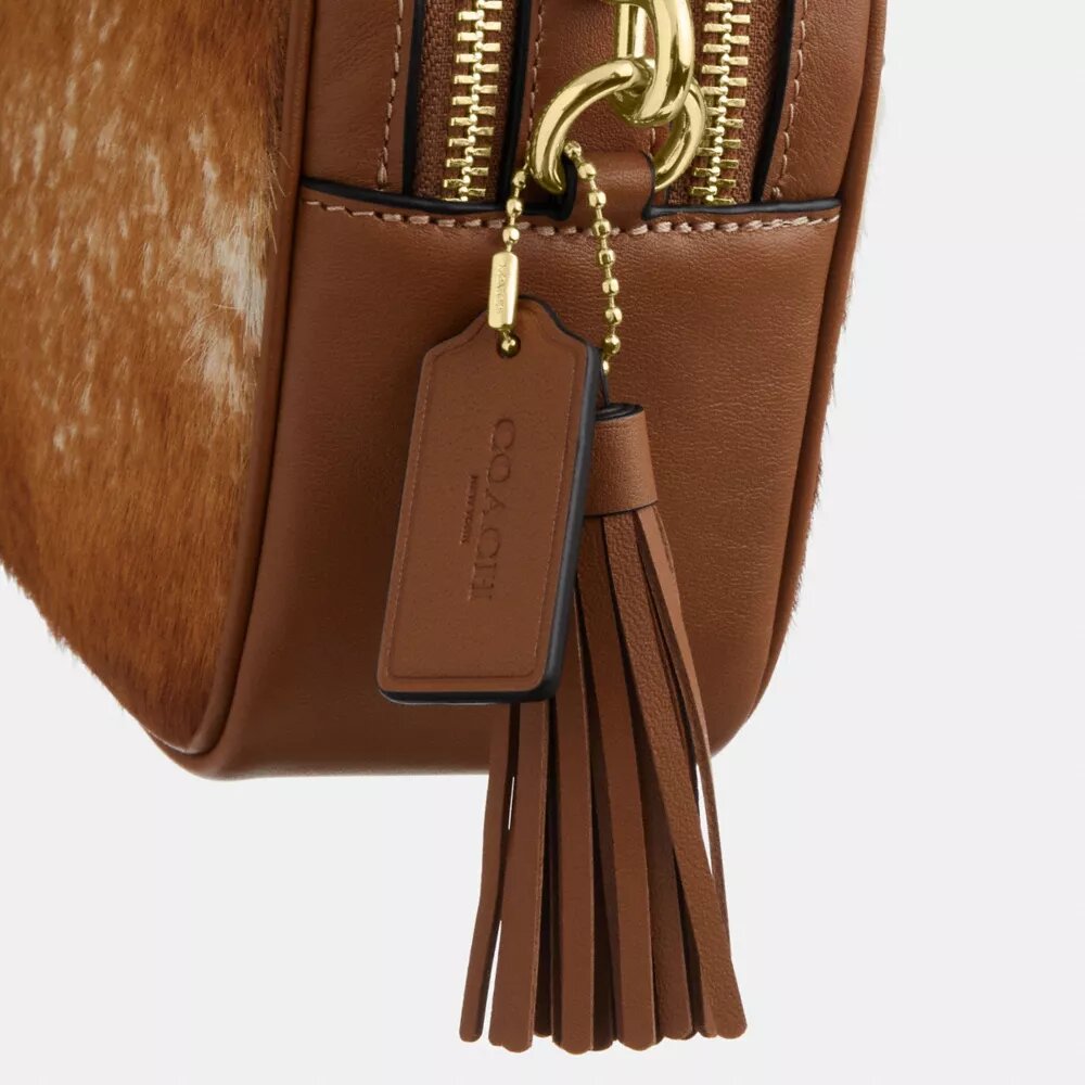 Bolso mini Carey de bandolera en piel de ternero con estampado de vaca