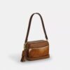 Bolso mini Carey de bandolera en piel de ternero con estampado de vaca