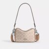 Bolso mini Carey de bandolera en Signature Canvas