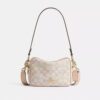 Bolso mini Carey de bandolera en Signature Canvas
