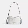 Bolso mini Carey de bandolera en Signature Canvas