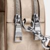 Bolso mini Carey de bandolera en Signature Canvas