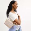 Bolso mini Carey de bandolera en Signature Canvas