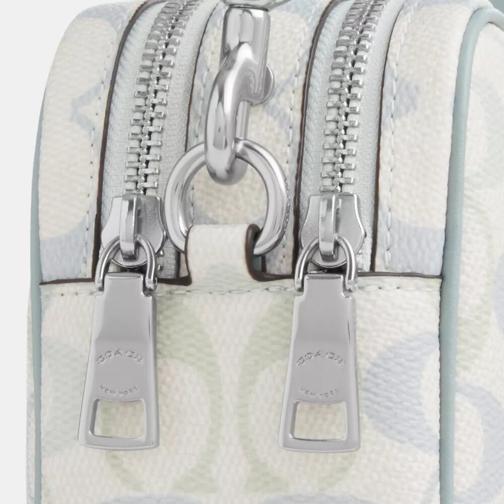 Bolso mini Carey de bandolera en Signature Canvas
