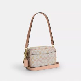 Bolso mini Carey de bandolera en Signature Canvas
