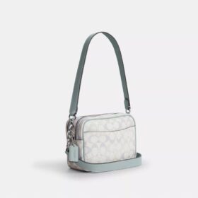 Bolso mini Carey de bandolera en Signature Canvas