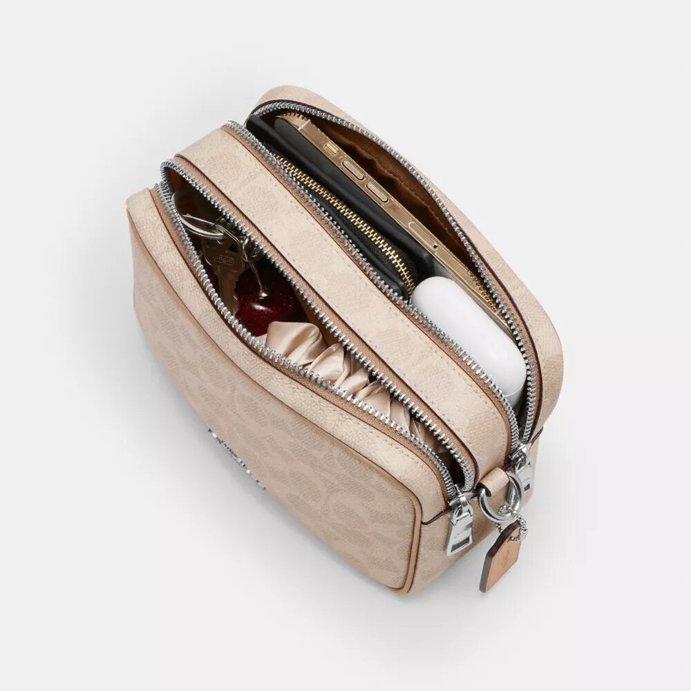 Bolso mini Carey de bandolera en Signature Canvas