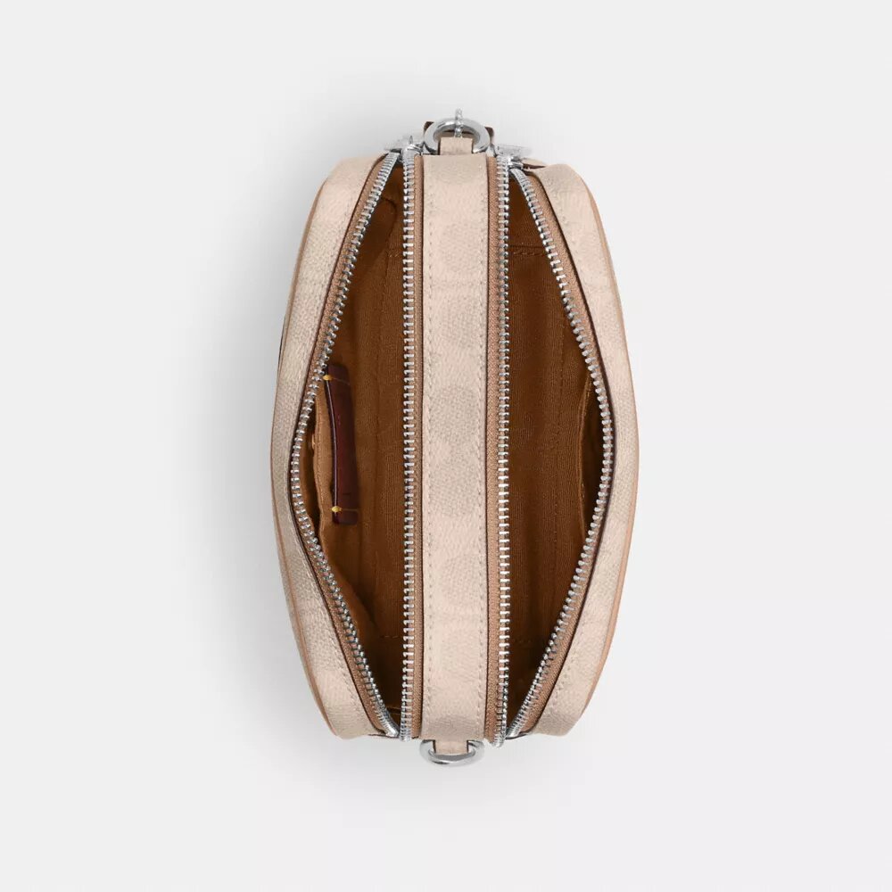 Bolso mini Carey de bandolera en Signature Canvas